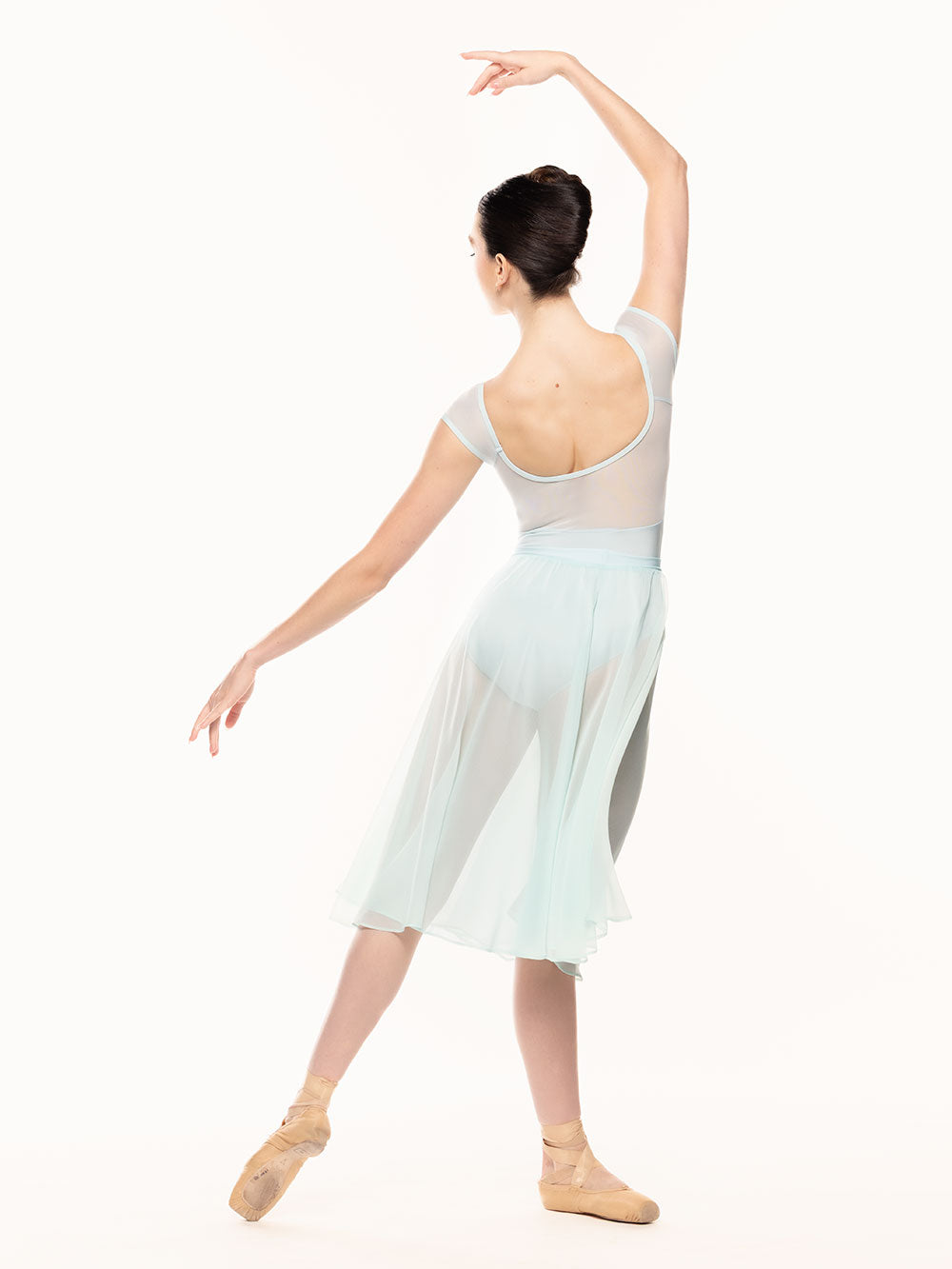 Eleve Dancewear Celine Leotard in Baby Blue print color, back view of dancer on tendu derriere croise