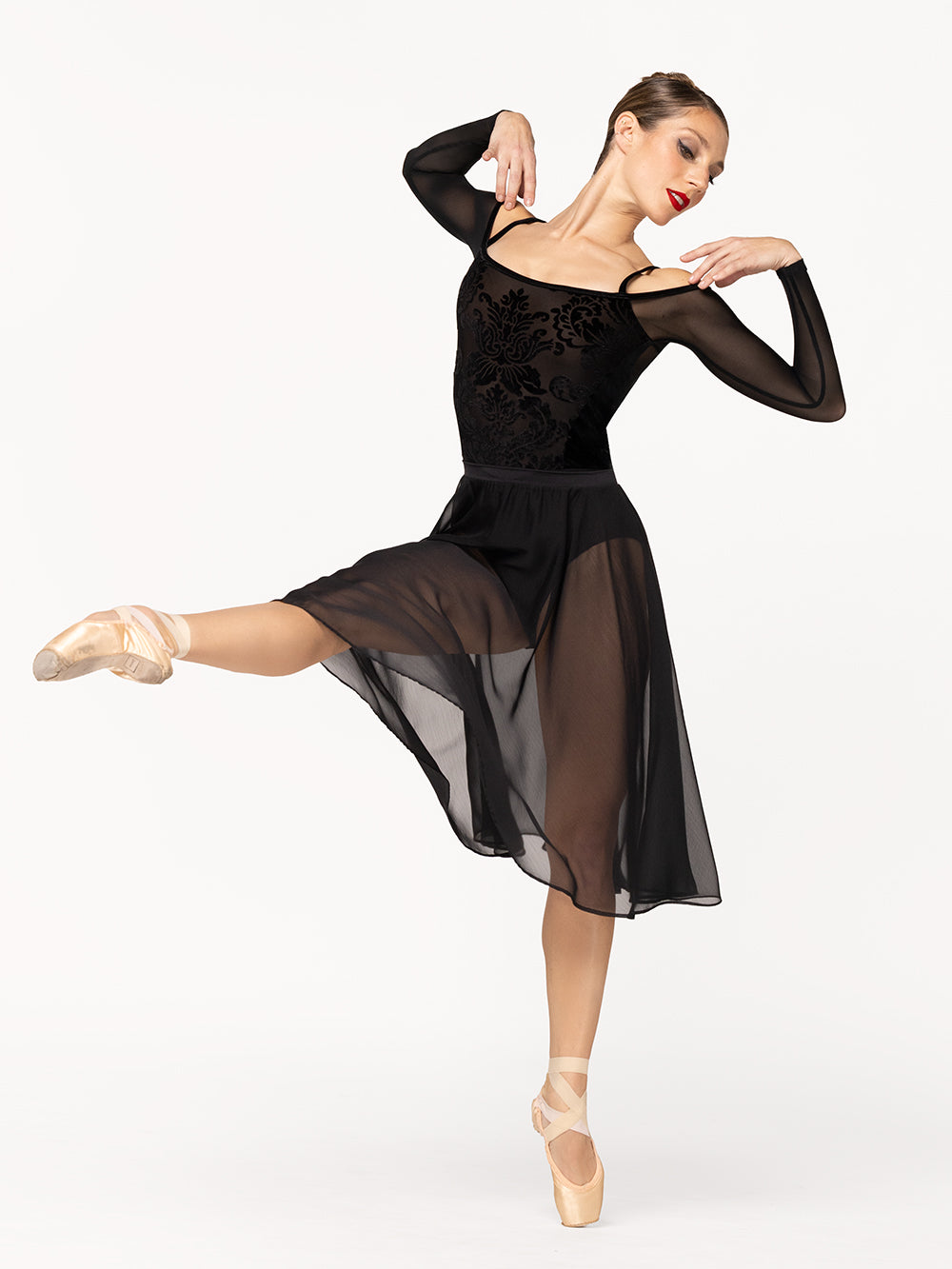 Eleve Dancewear Tatiana Leotard in Baroque Black print color, front view of dancer on a develop devant efface on point.