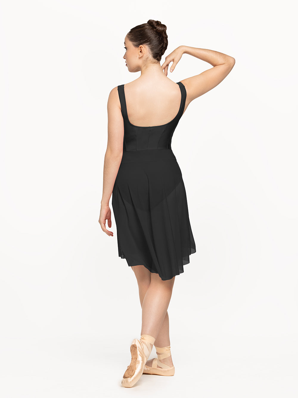 Eleve Dancewear Amora Long High-Low Skirt Kids in Black Mesh color, back view of dancer posing.