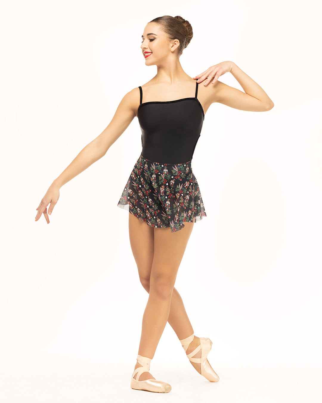 Eleve Dancewear Helena Leotard in Black color, front view of dancer on coup-de-pie.