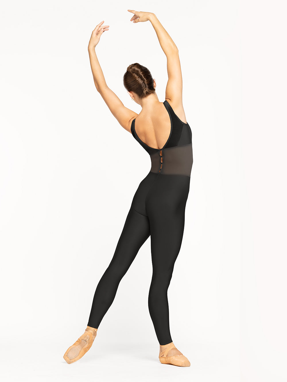 Eleve Dancewear Sholeh Unitard Kids in Black color, back view of dancer on tendu derriere efface and fifth arms