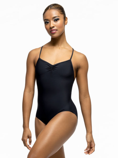 Model is wearing solid black leotard with front and back pinch and crossed cami straps.