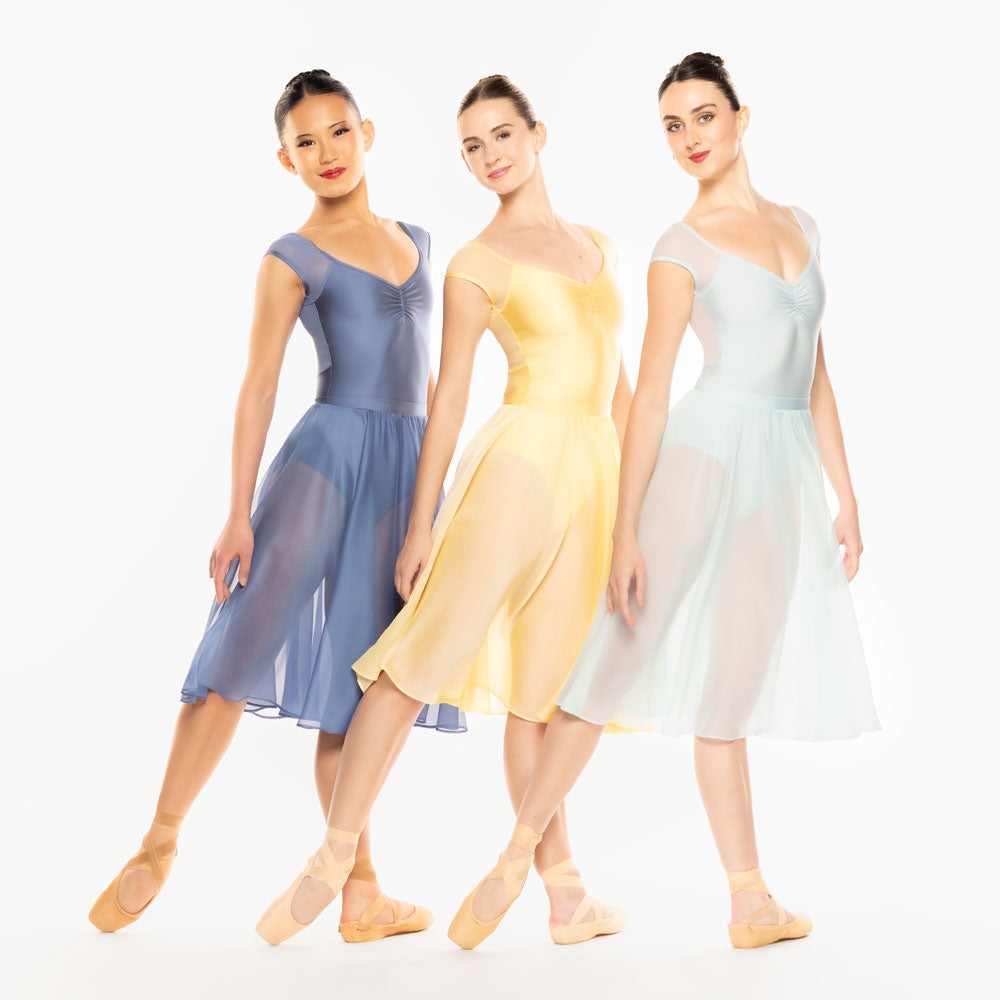 Eleve Dancewear Chiffon Rehearsal Skirt Kids in Sunshine print color, front view of three dancers on tendu derriere and arms extended