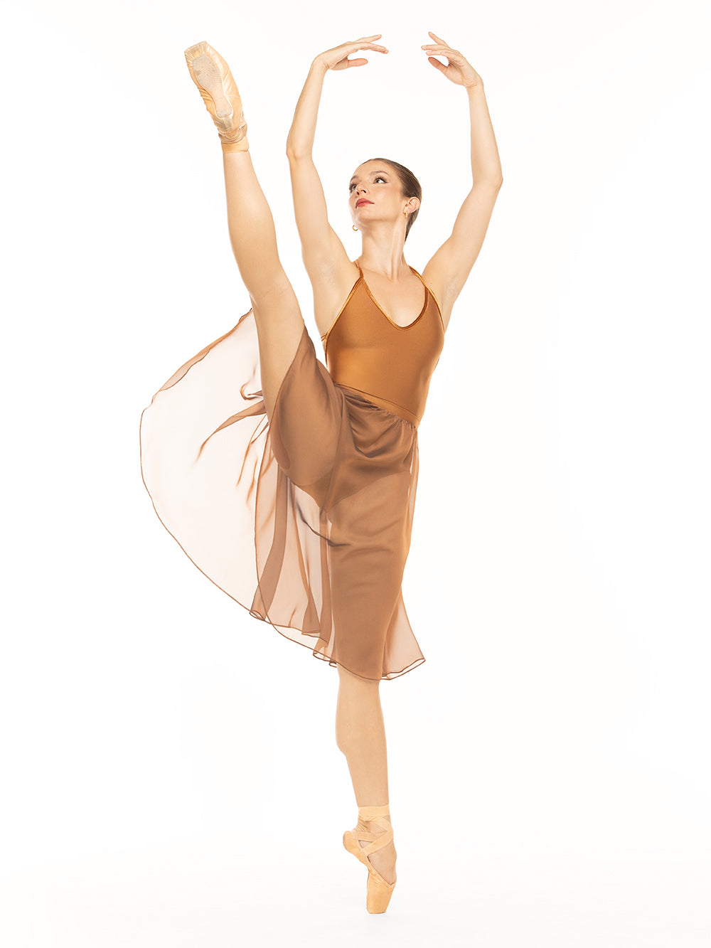 Eleve Dancewear Iris Leotard Kids in Cognac print color, front view of dancer posing on a la seconde on point.