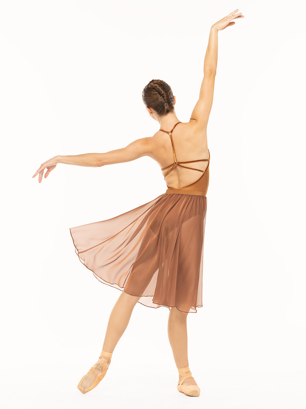 Eleve Dancewear Iris Leotard in Cognac print color, profile view of dancer posing on tendu derriere.