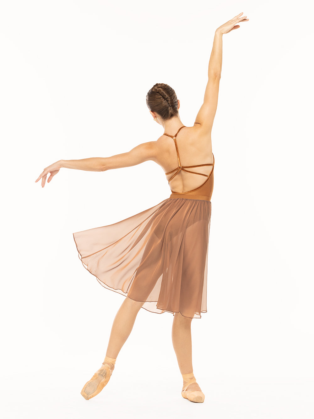 Eleve Dancewear Iris Leotard in Cognac print color, profile view of dancer posing on tendu derriere.