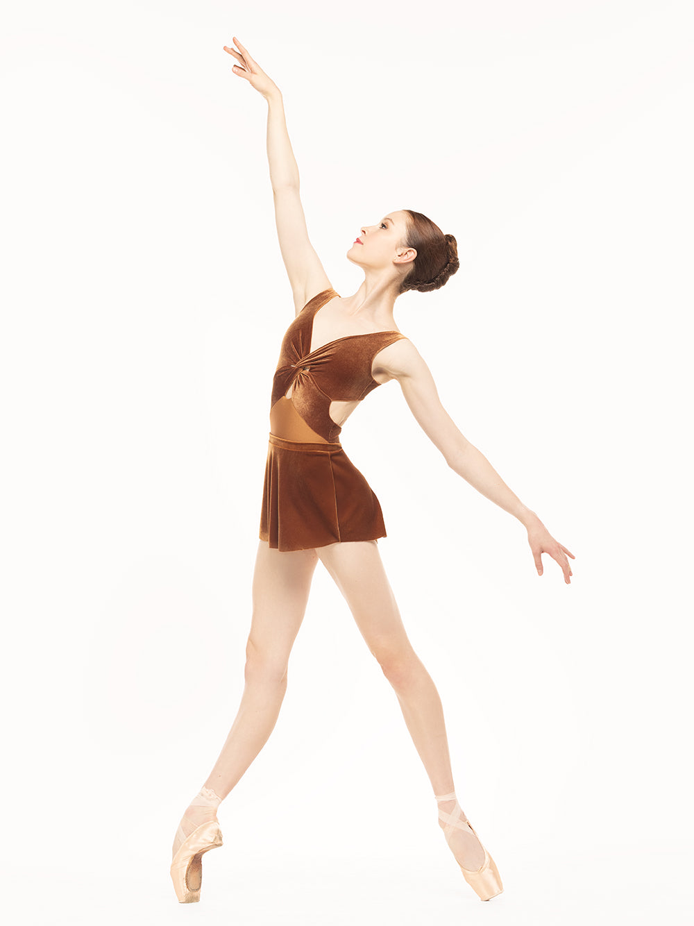 Eleve Dancewear Jackie Leotard in Cognac Velvet print color, profile view of dancer posing in four position on point.