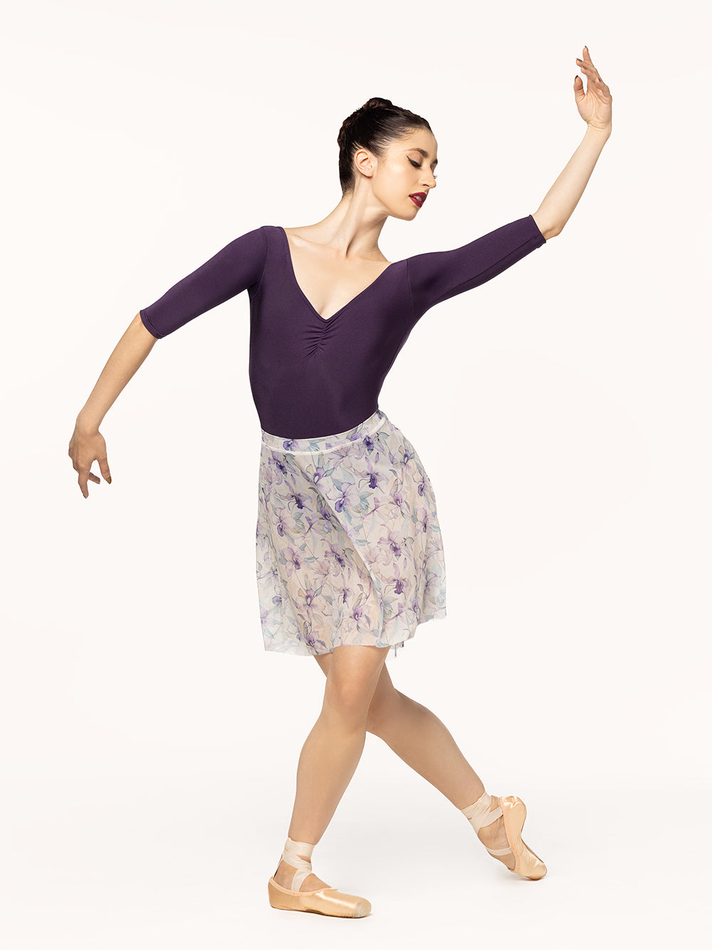 Eleve Dancewear Stella Leotard Kids in Eggplant print color, front view of dancer posing.