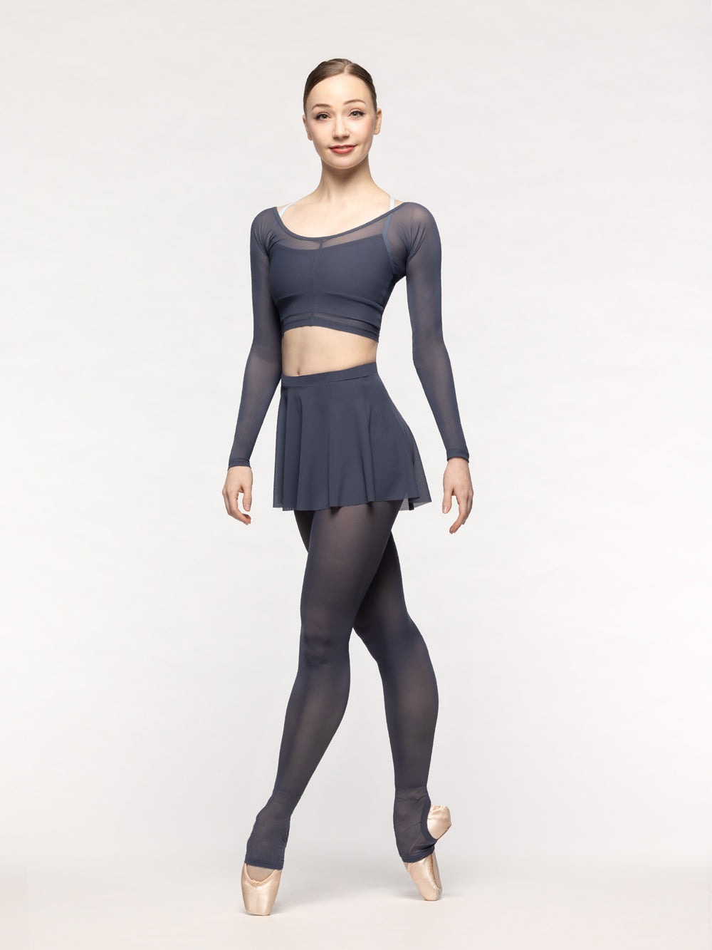Eleve Dancewear Flare Skirt in Graphite Mesh print color, front view of dancer on four on point