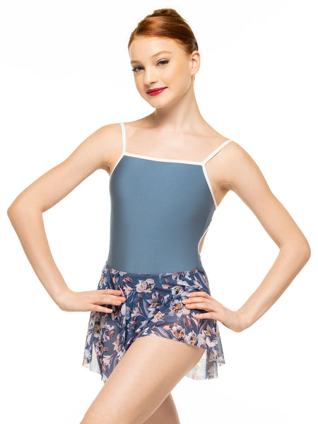 Model is wearing deep blue floral print mesh full circle mini skirt with shiny blue bodysuit.