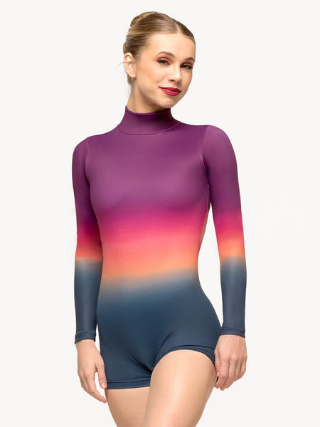 Model is wearing sunset gradient activewear onesie with long sleeves, booty length inseam, high neck, and open back.