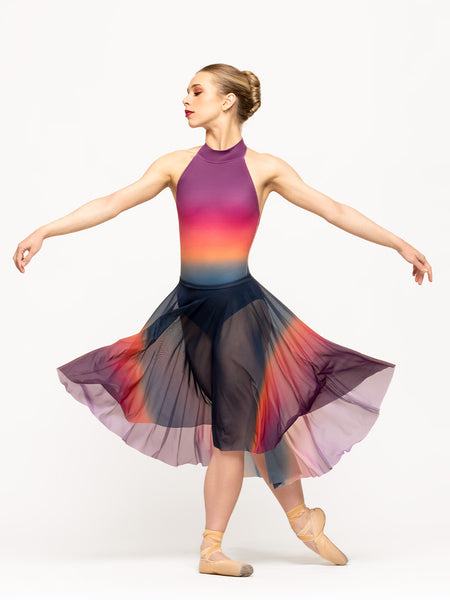 Model is wearing rainbow ombre long full circle mesh skirt with matching ombre halter leotard.