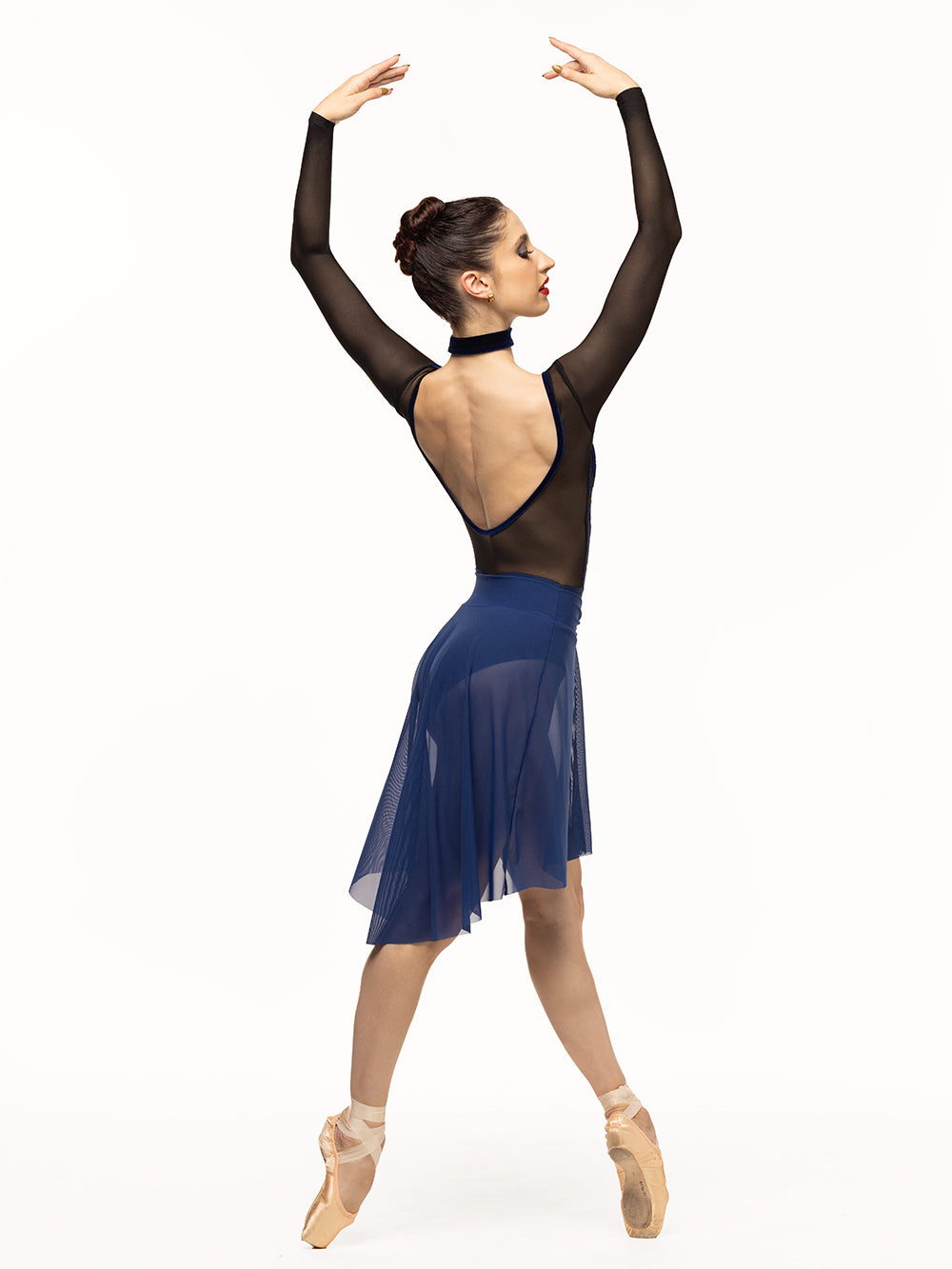 Eleve Dancewear Skylar Leotard Kids in Baroque Sapphire color print, profile view of dancer posing on effacé four position on point.