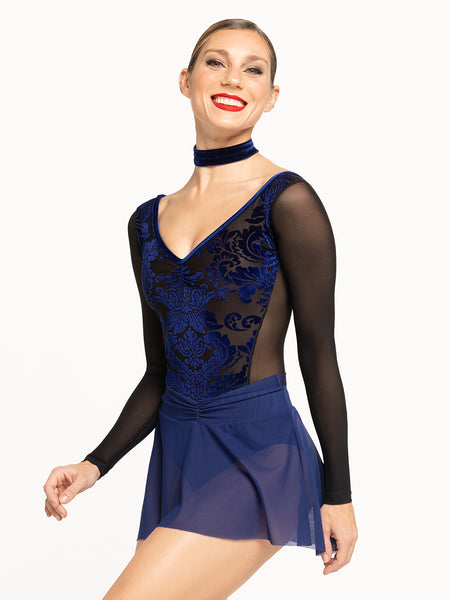 Eleve Dancewear model is wearing Skylar Leotard in the color Baroque Sapphire and Amora Mesh Skirt in the color Sapphire posing facing front.