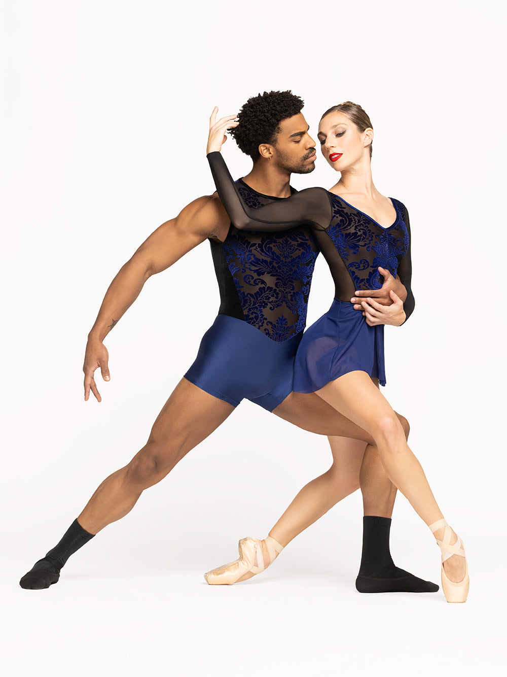 Eleve Dancewear Amora Short Skirt in Sapphire Mesh print color, profile view of two dancers posing.