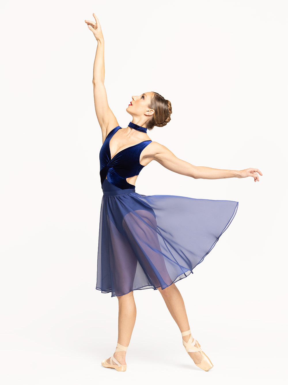 Eleve Dancewear Rehearsal Skirt Kids Sapphire Chiffon color, profile view of dancer on tendu derriere efface.