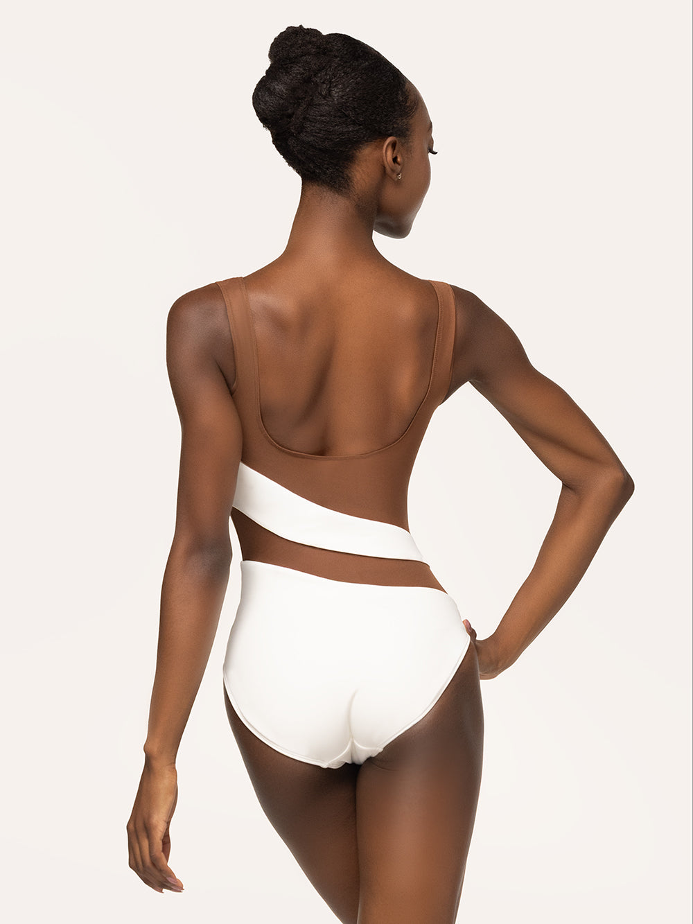 Eleve Dancewear Lunata Leotard Kids in Stage White Mocha color with back view of model posing.