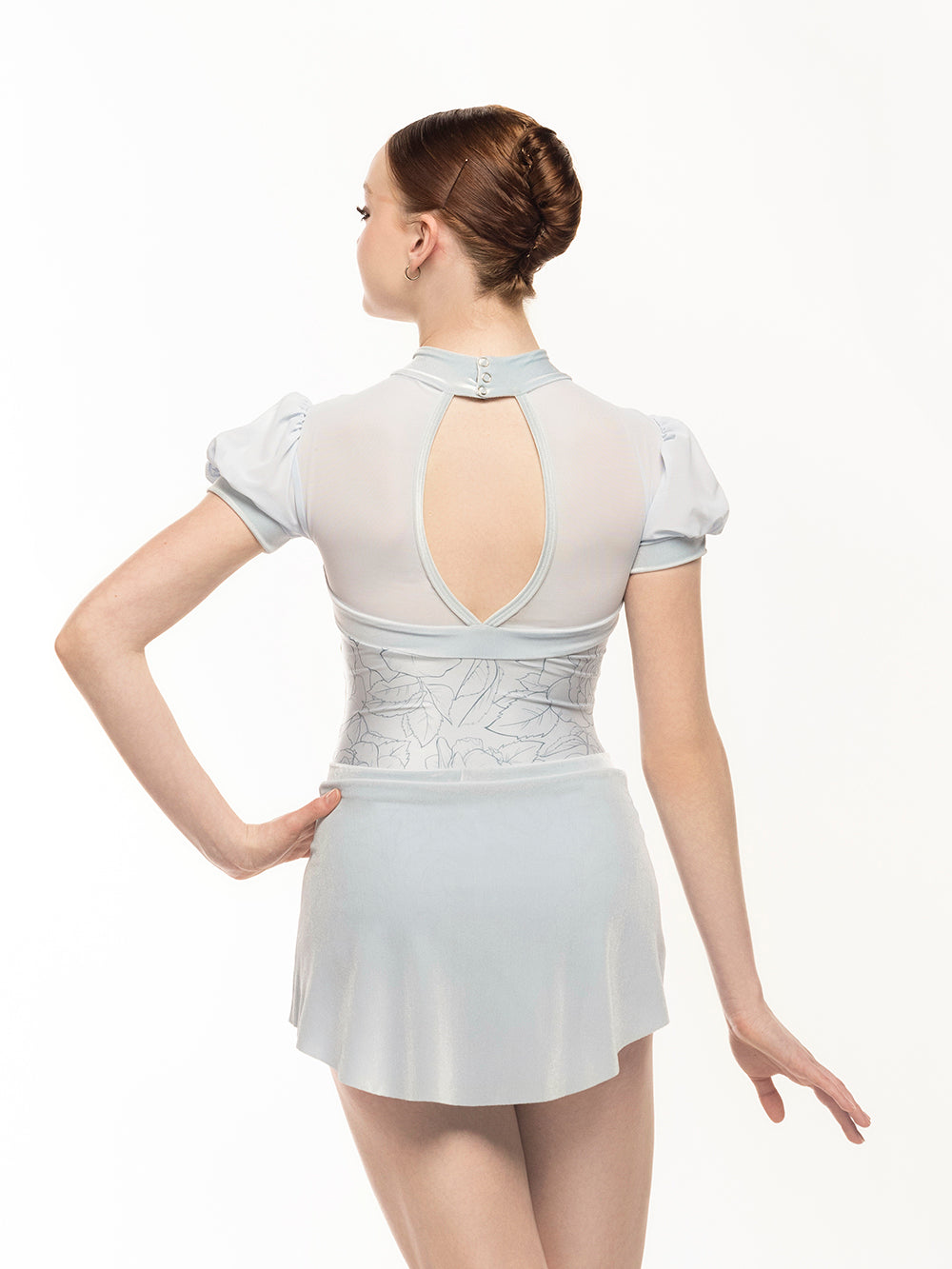 Eleve Dancewear Grace Leotard in Stencil Flowers print color, back detail view of dancer posing
