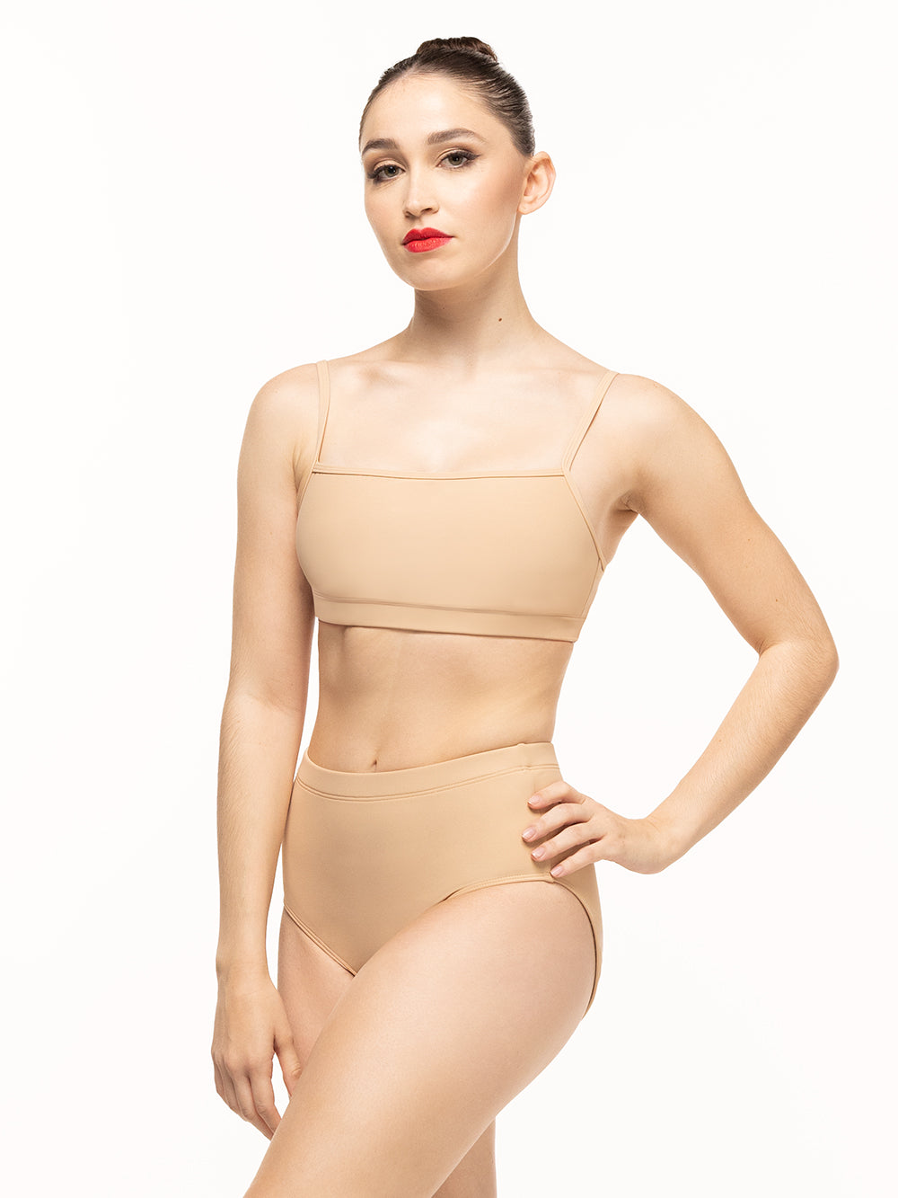 Eleve Dancewear model is wearing Aisling Crop Top and Dana Briefs in the color Tan posing facing front. 