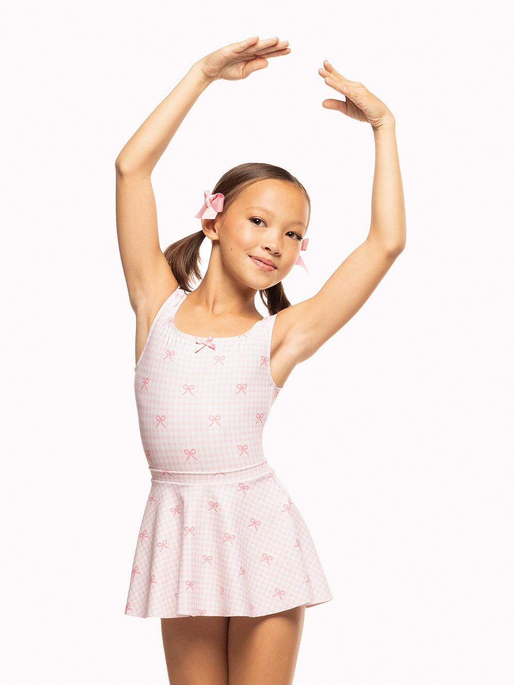 Eleve Dancewear Flare Skirt Kids in Tiny Bows print color, front torso view