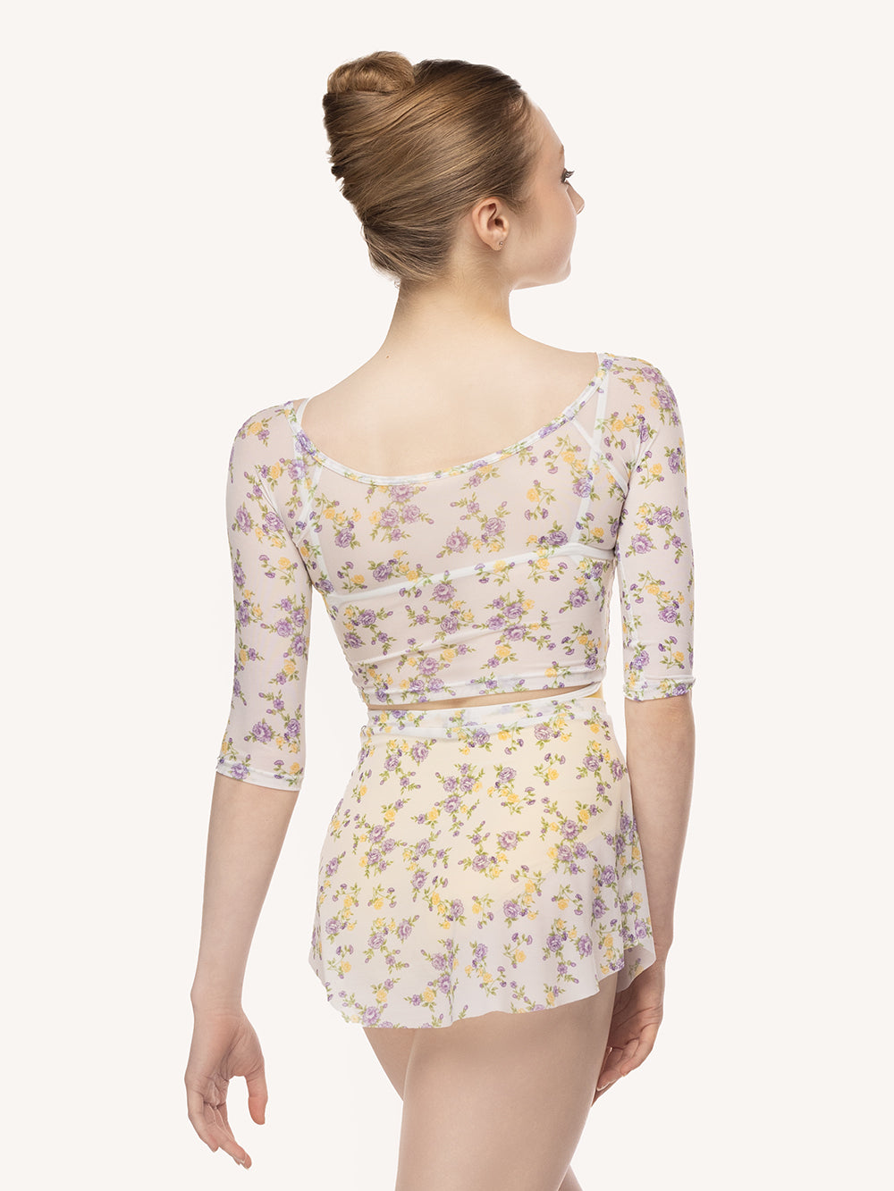 Eleve Dancewear Tulip Skirt in Violetta print, back detail view of dancer posing.