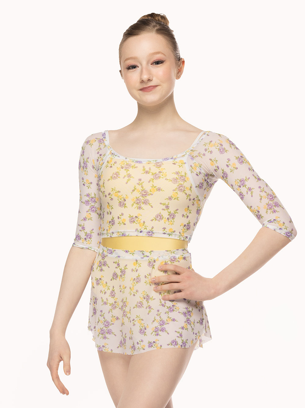 Eleve Dancewear Raglan Crop Top in Violetta print, front view of dancer posing.