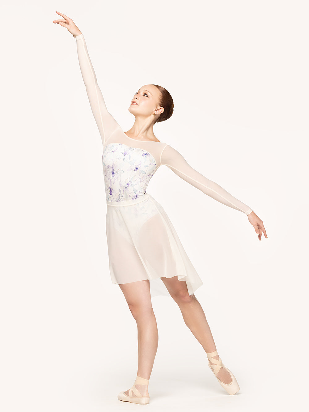 Eleve Dancewear Victoria Leotard in Wild Orchid print, front view of dancer posing on tendu derriere.
