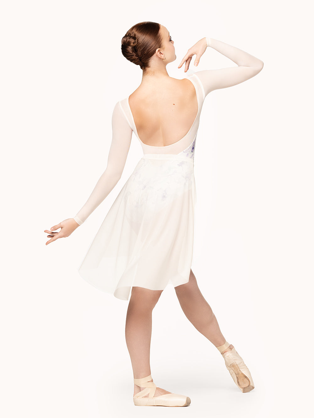 Eleve Dancewear Victoria Leotard in Wild Orchid print, back view of dancer posing on tendu.