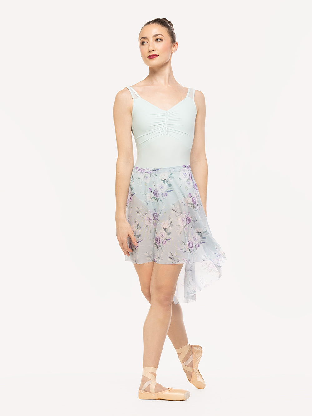 Eleve Dancewear Amora Long High-Low Skirt in Moonlit Garden Baby Blue Mesh print color, front view of dancer on cou-de-pie flat