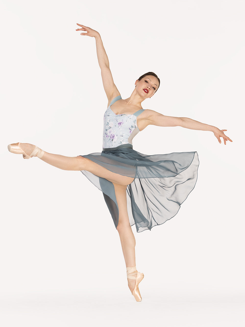 Eleve Dancewear Chiffon Rehearsal Skirt Kids in Blue Agave print color, front view detail of dancer on pique devant croise epaulement