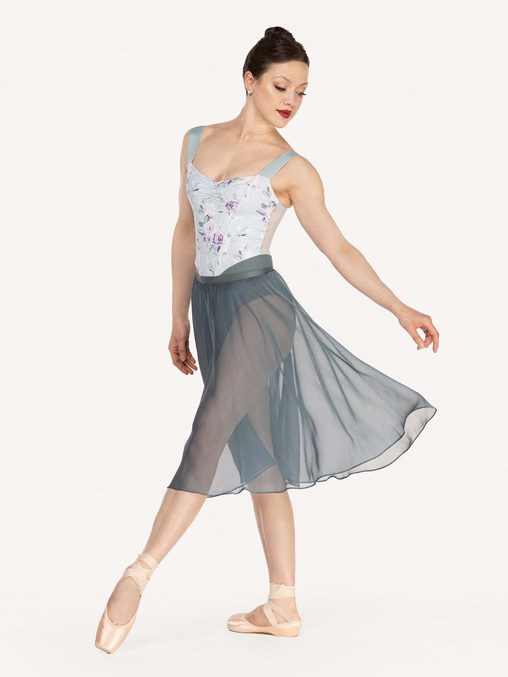 Eleve Dancewear Chiffon Rehearsal Skirt Kids in Blue Agave print color, front view detail of dancer on tendu devant croise