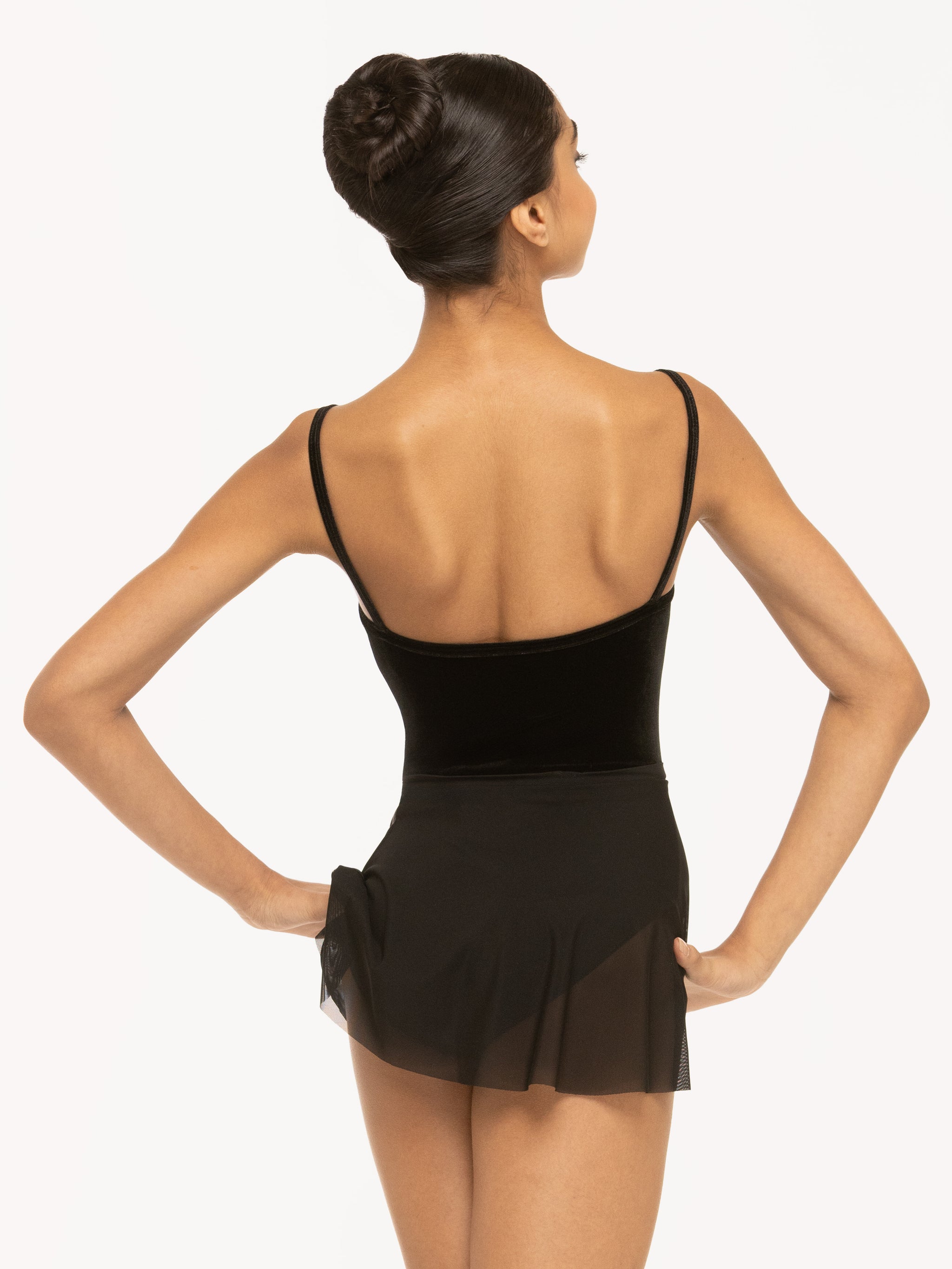 Eleve Dancewear Flare Skirt in Black Mesh print color, back view of model posing