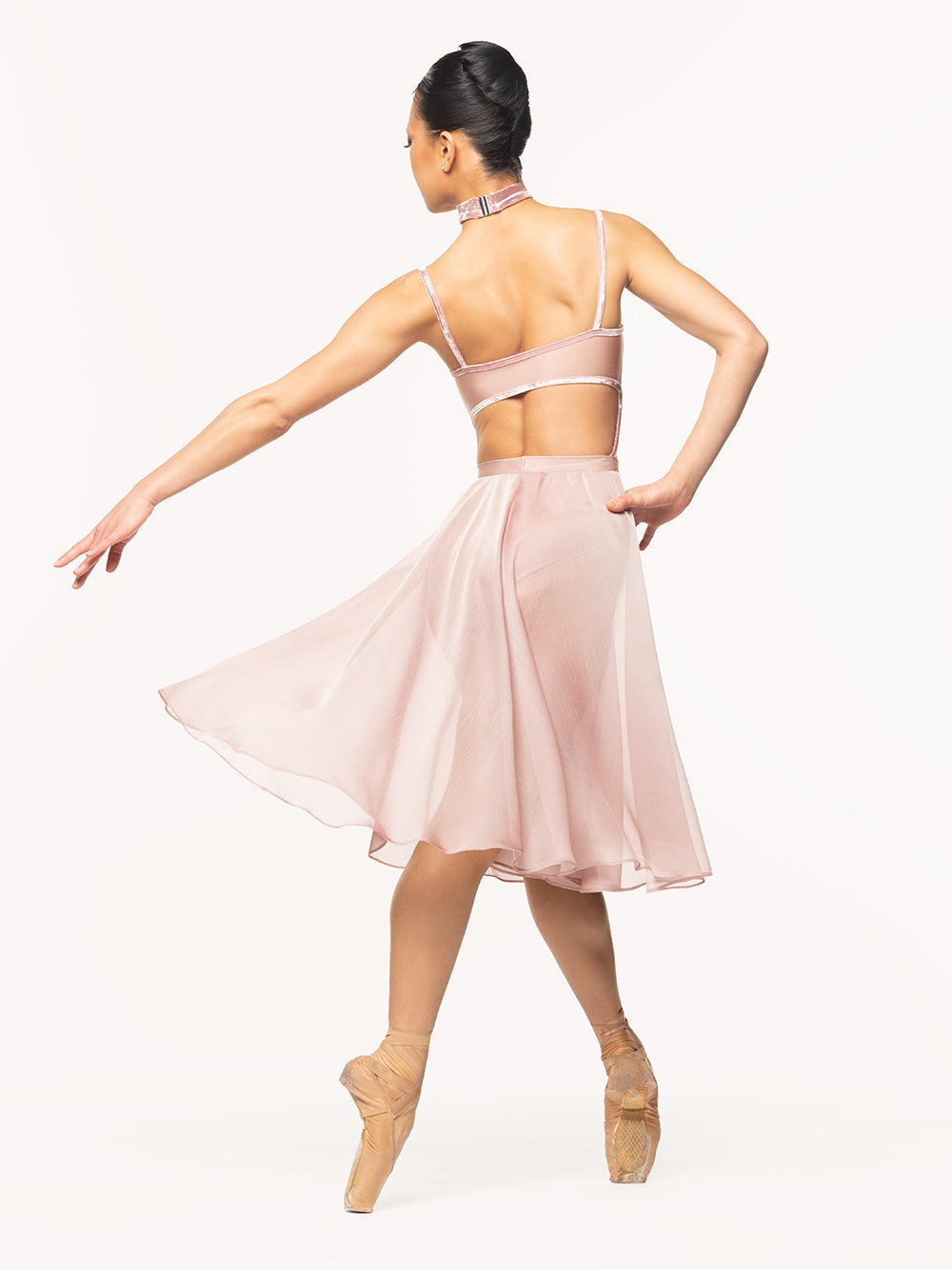 Eleve Dancewear Chiffon Rehearsal Skirt in Dusty Rose print color, back view of dancer on four on point croise