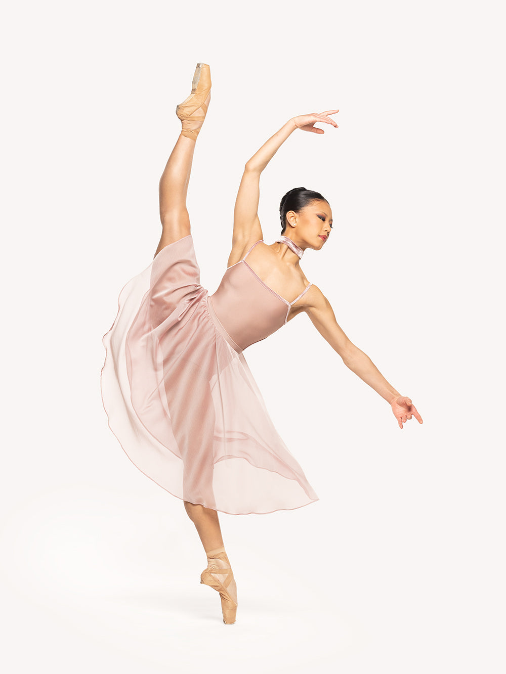 Eleve Dancewear Chiffon Rehearsal Skirt Kids in Dusty Rose print color, front view of dancer on high a la seconde