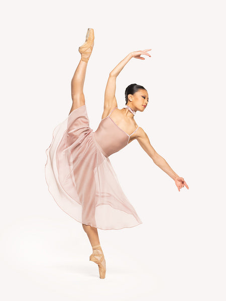 Eleve Dancewear Chiffon Rehearsal Skirt Kids in Dusty Rose print color, front view of dancer on high a la seconde