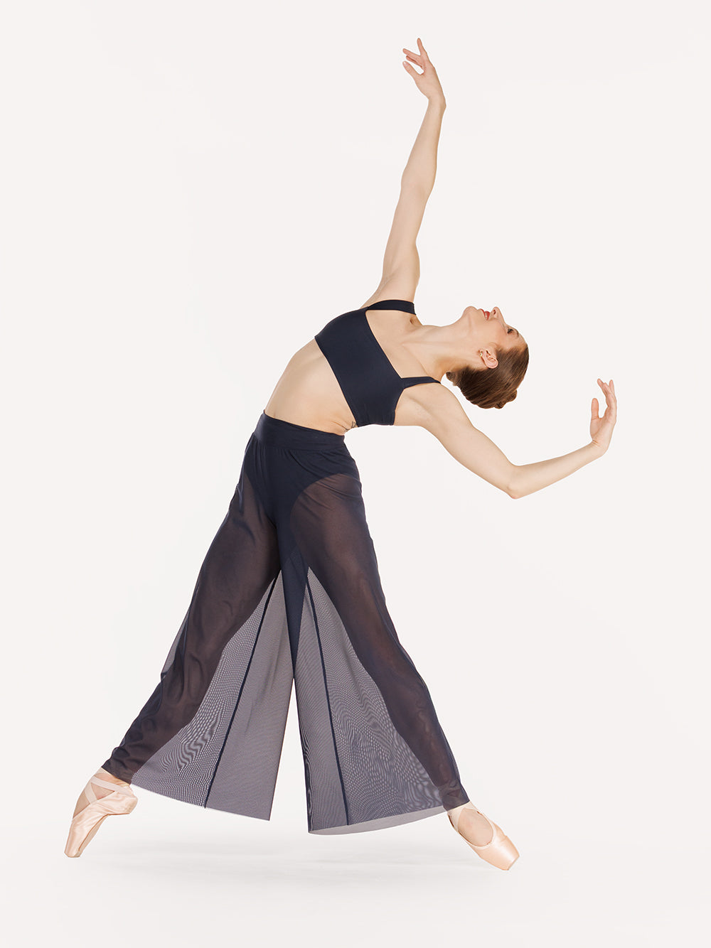 Eleve Dancewear A-Line Pants Kids in Eclipse Mesh color, profile view of dancer on point four efface and cambre