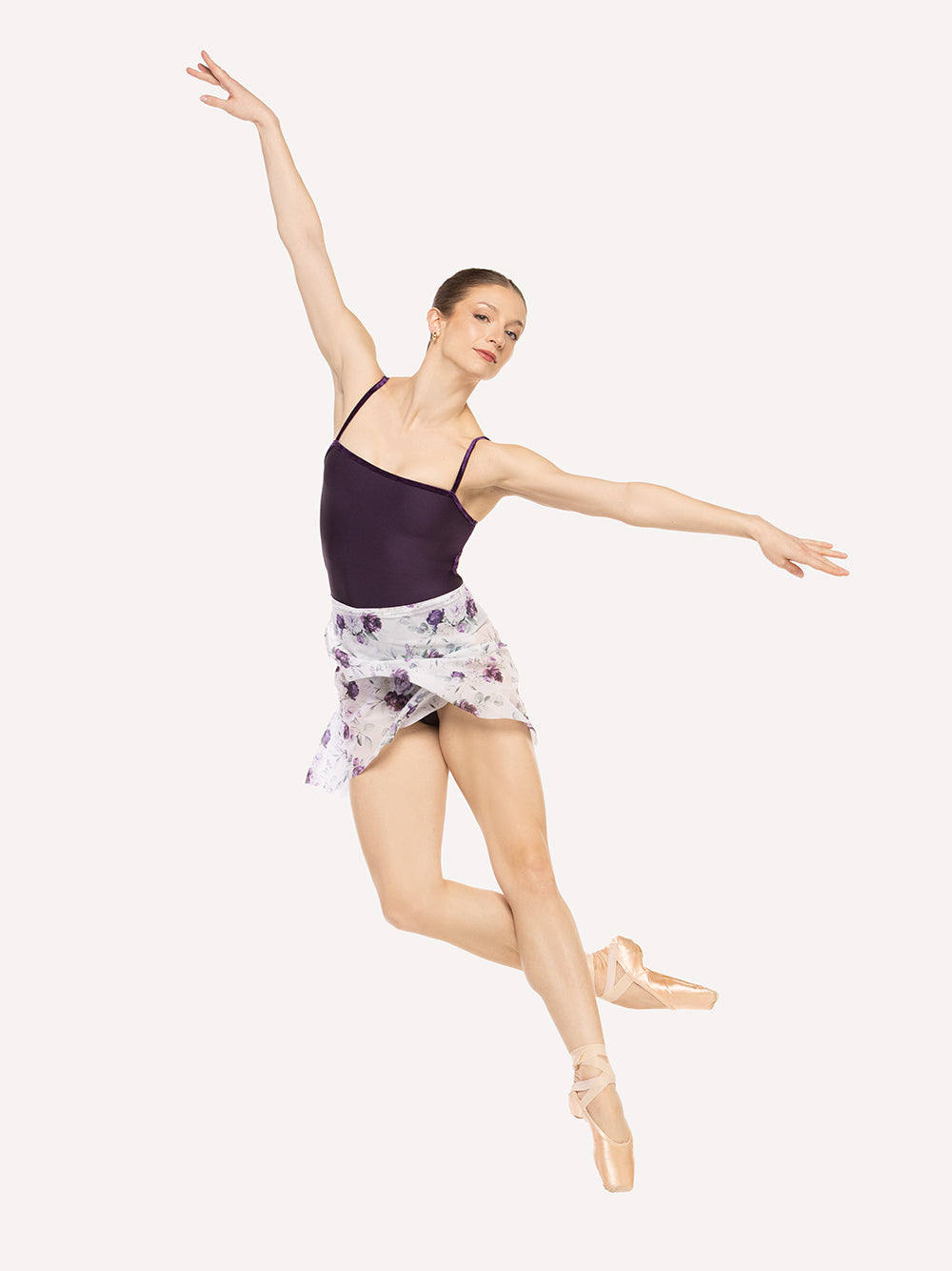 Eleve Dancewear Vienna Mid High-Low Wrap Skirt Kids in Moonlit Garden Mesh print color, front view of dancer on pique cou-de-pie epaulement