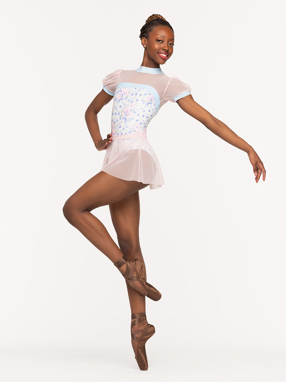 Eleve Dancewear Grace Leotard in Encore print, profile view of dancer on pique cou-de-pie en dedans