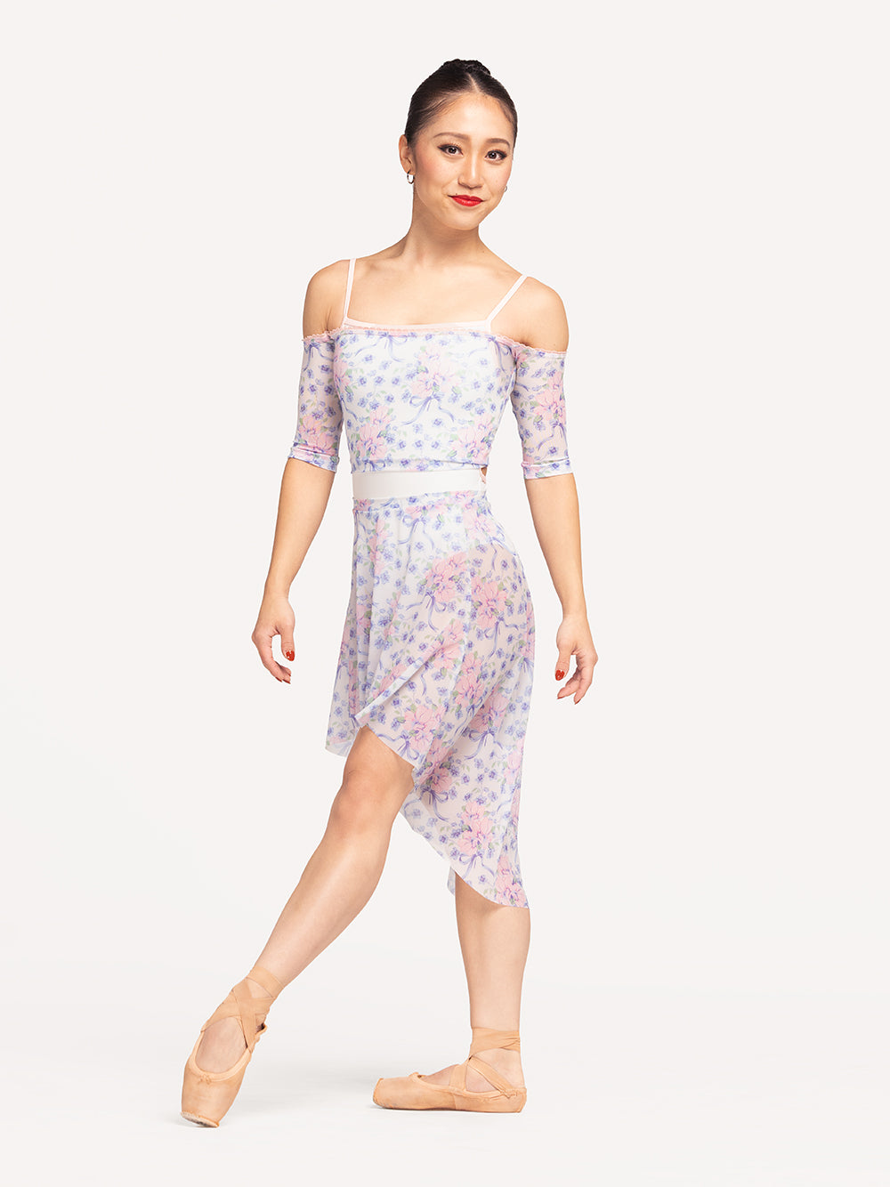 Eleve Dancewear Open Shoulder Crop Top in Encore Mesh print, front view of dancer on tendu devant croise