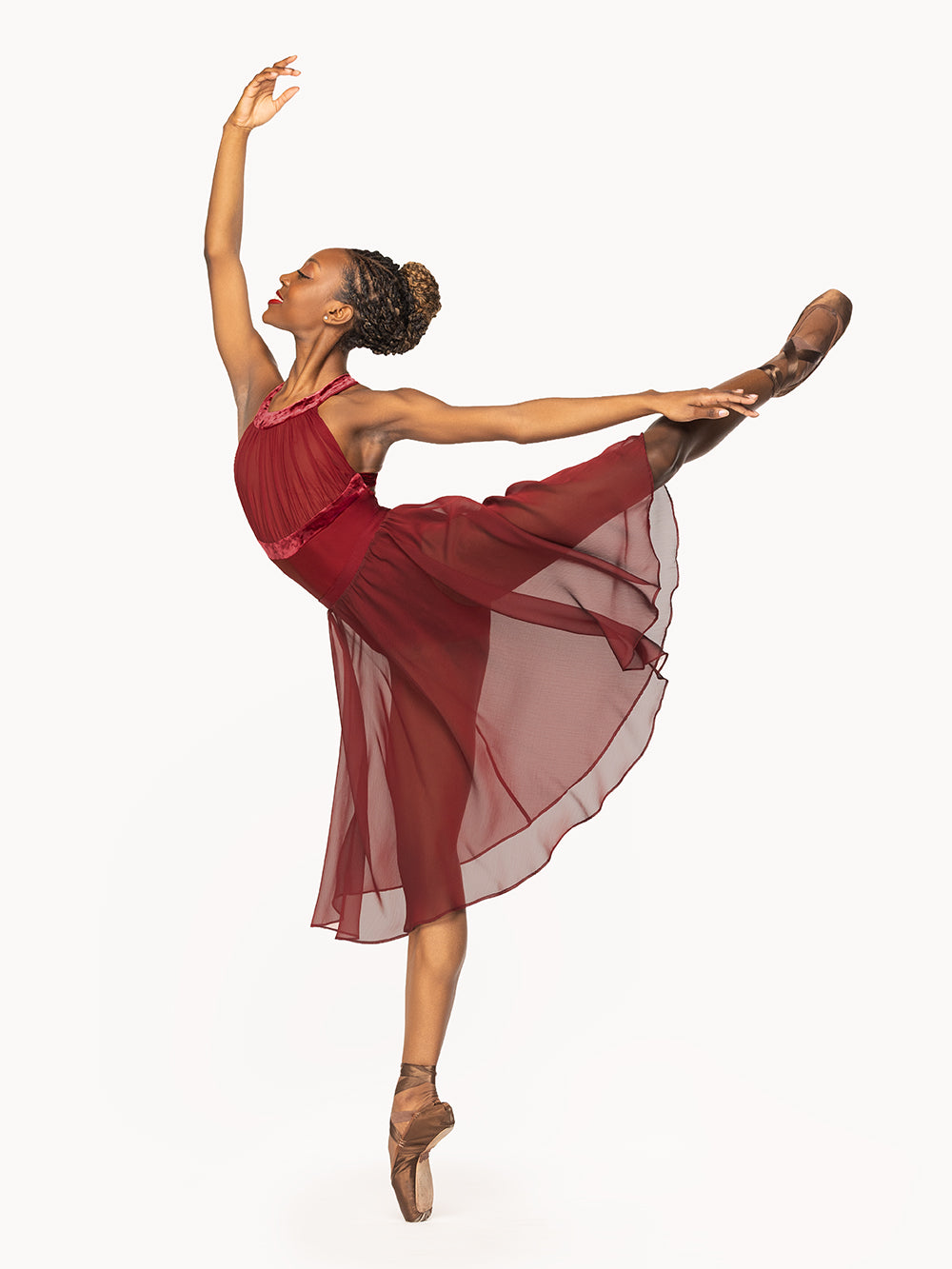 Eleve Dancewear Aria Leotard in Garnet print color, front view of dancer on pique first arabesque