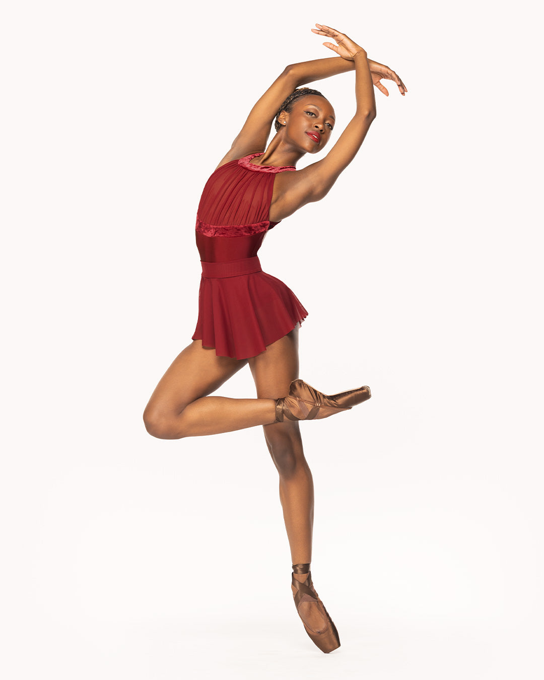 Eleve Dancewear Aria Leotard in Garnet print color, front view of dancer on pique crossed passe