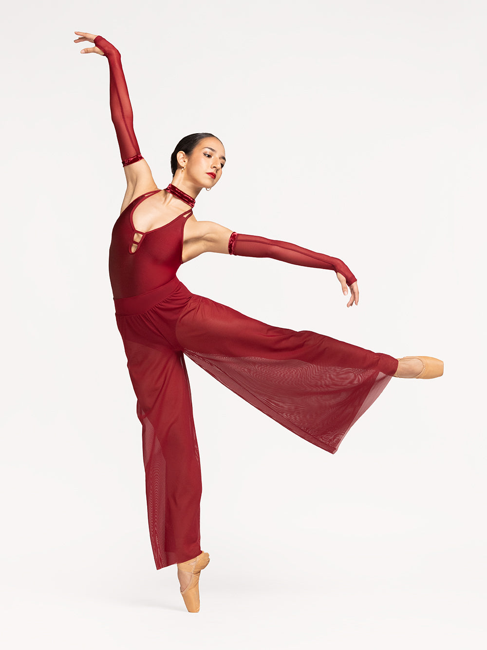 Eleve Dancewear A-Line Pants in Garnet Mesh print color, front view of dancer on pique first arabesque epaulement