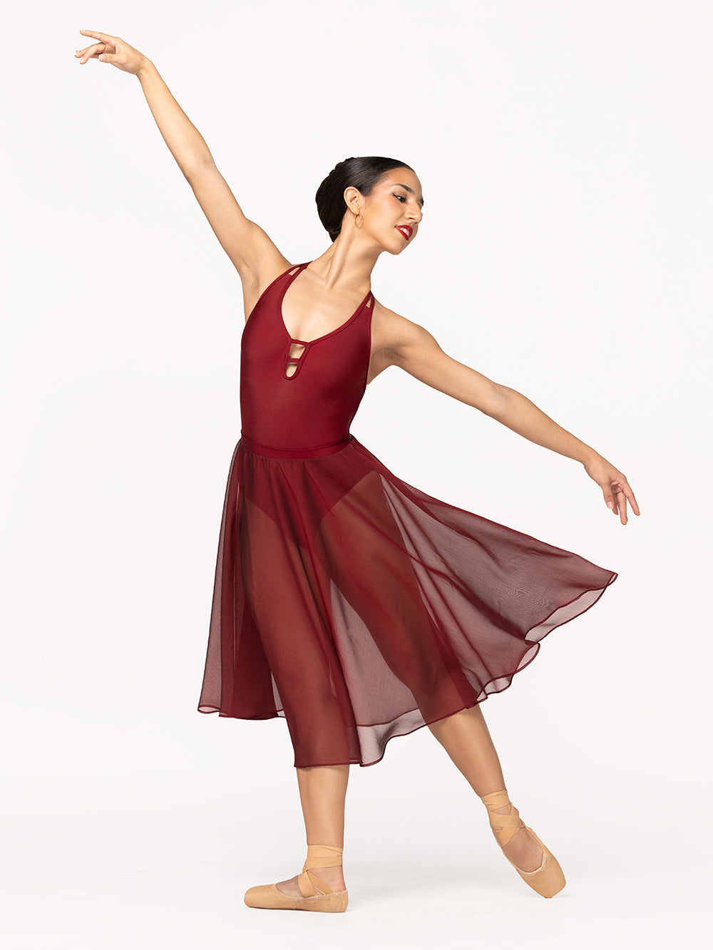 Eleve Dancewear Ilia Leotard in Garnet print color, front view of dancer on tendu derriere efface epaulement