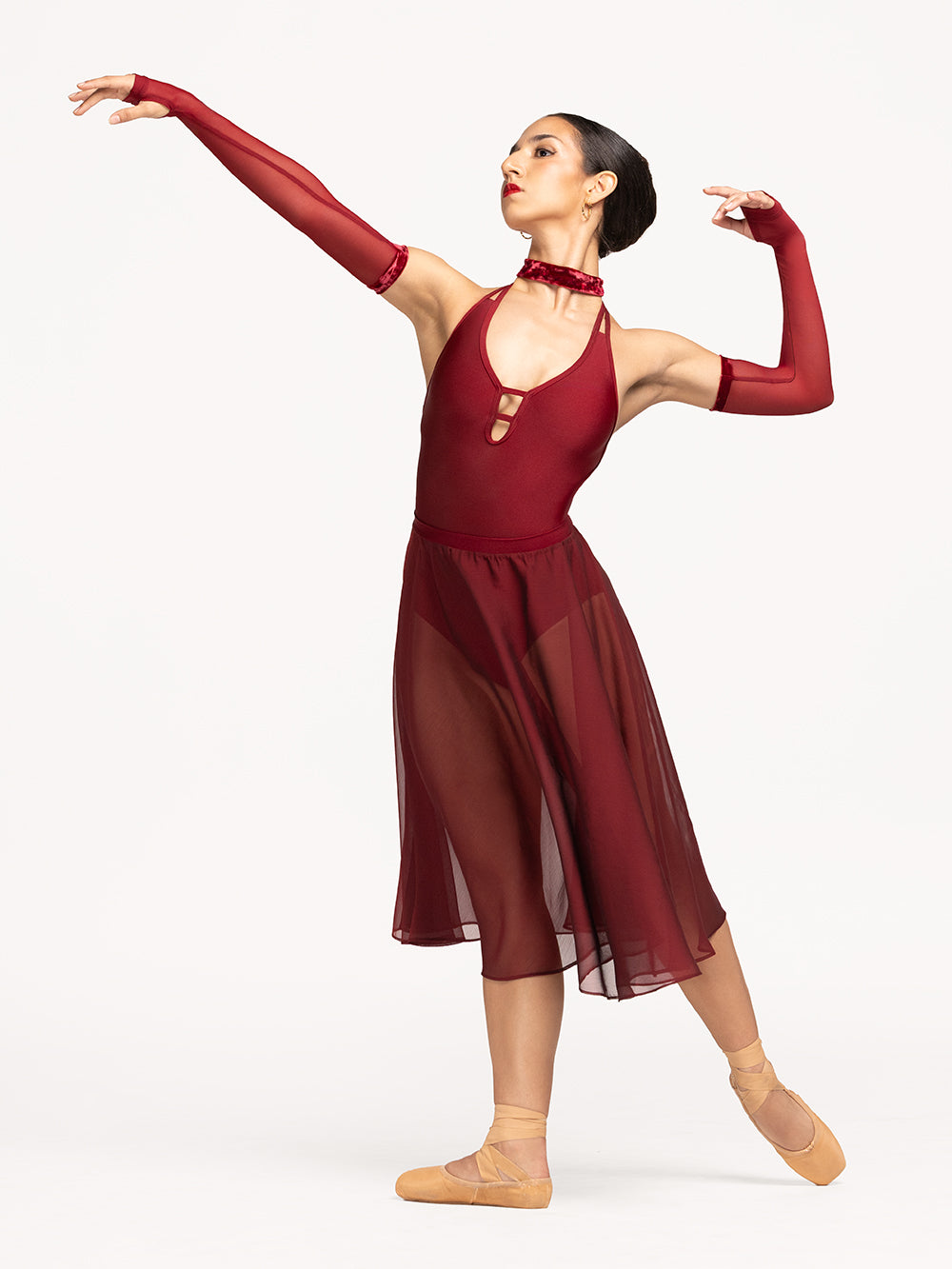 Eleve Dancewear Ilia Leotard in Garnet print color, front detail view of dancer on tendu derriere efface epaulement