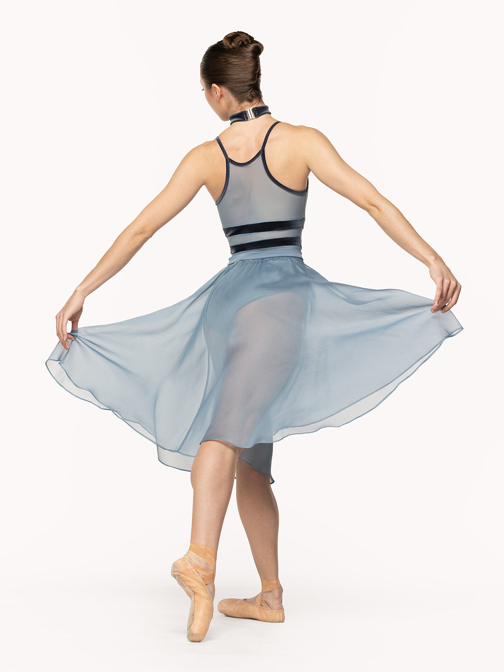 Eleve Dancewear Chiffon Rehearsal Skirt in Light Jean print color, back view of dancer on tendu derriere croise