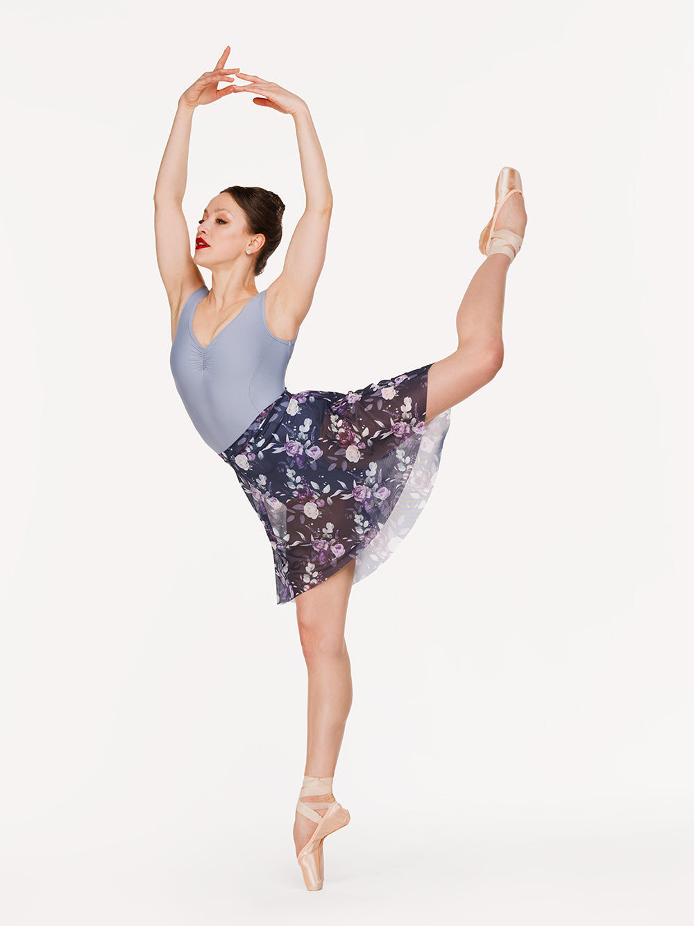 Eleve Dancewear Back Tuck Skirt in Moonlit Garden Eclipse Mesh print color, front view of dancer on pique attitude derriere efface