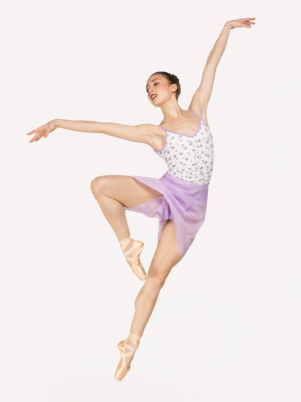 Eleve Dancewear Back Tuck Skirt in Whisper Mesh color, front view of dancer on pique leaning side on passe epaulement