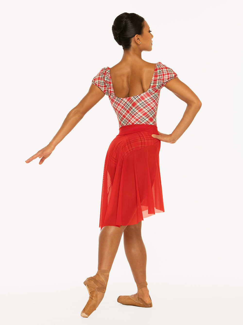 Eleve Dancewear Xena Leotard Kids in Pink & Red Plaid print, back view of dancer on tendu derriere