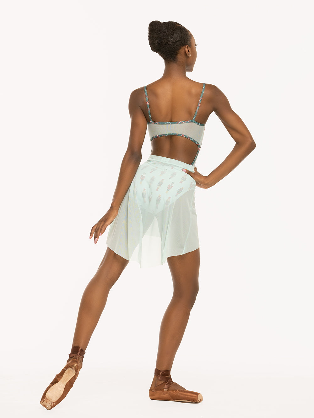 Eleve Dancewear Mid High-Low Skirt in Pool Mesh print color, back detail view of dancer posing