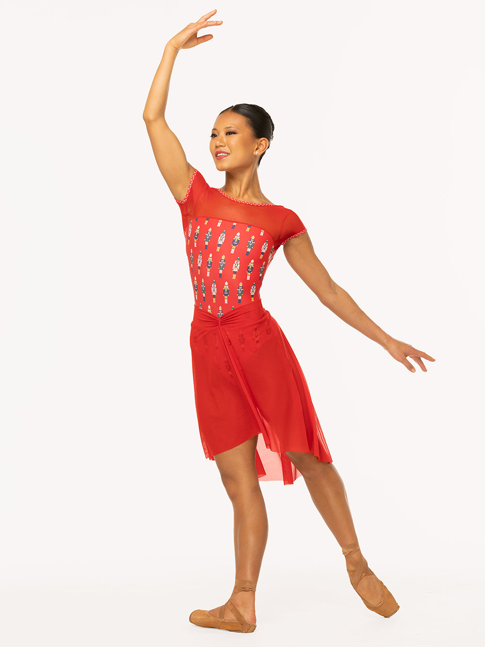 Eleve Dancewear Ida leotard in More Nuts Red print, front view of dancer on tendu derriere